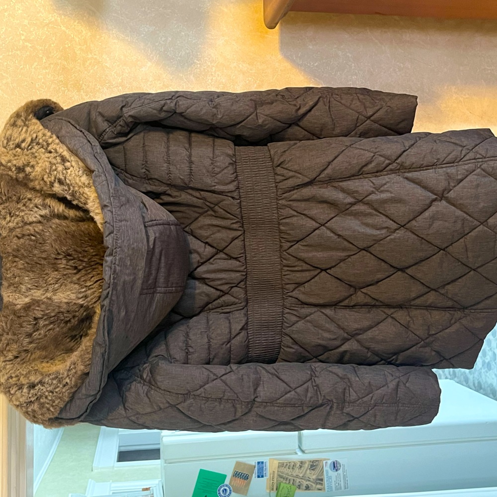 Gray winter thigh length coat. Worn for one season.